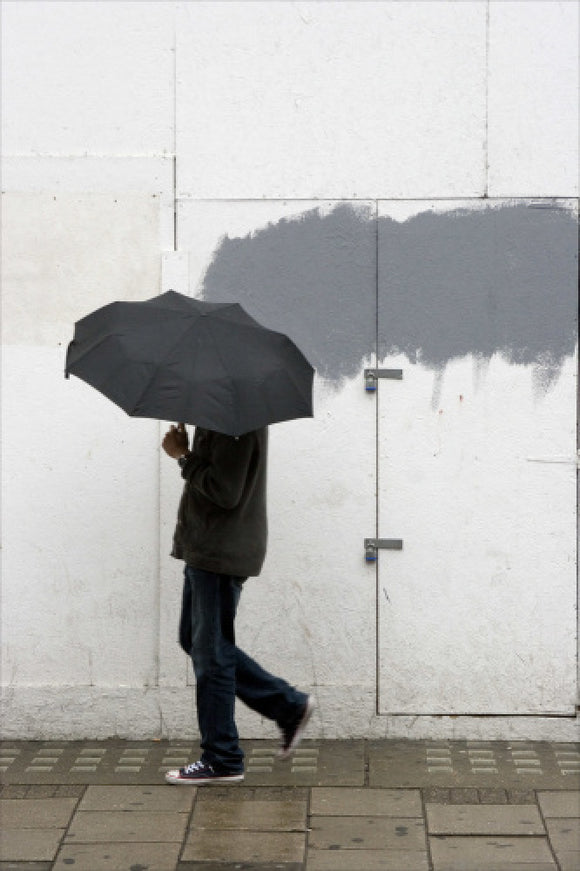 A man walking with umbrella in New Oxford Street; 2008