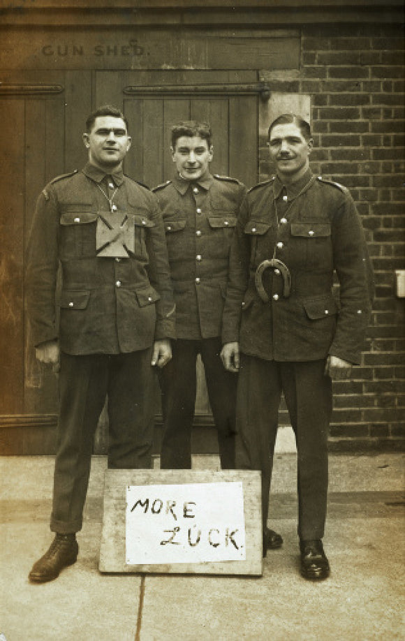 Three soldiers stand with a message of Hope; c.1914