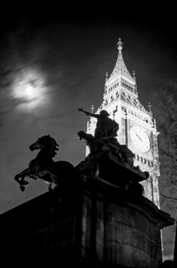 Statue of Boudica with Big Ben floodlit behind.